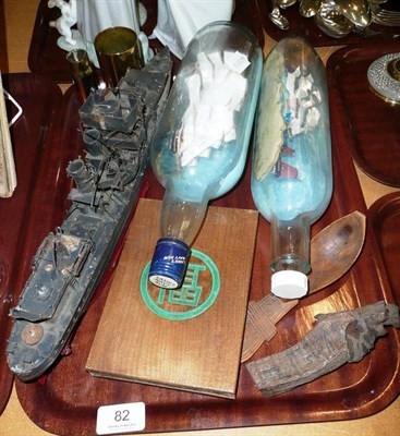 Lot 82 - Two ships in bottles, hand made boat from tins, carved spoon and other collectables