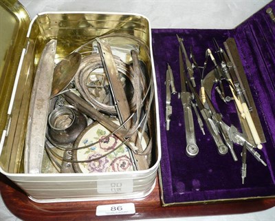 Lot 86 - Tin of scrap silver and a drawing set cased (2)