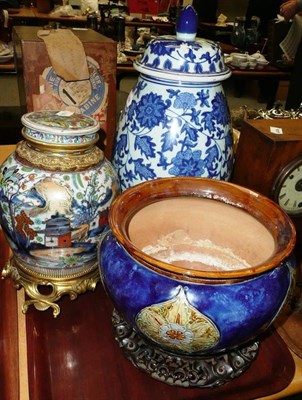 Lot 93 - Doulton jardiniere, blue and white jar and cover and a Chinese jar and cover with clobbered...