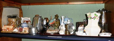Lot 115 - A shelf of assorted decorative ceramics and two miner's safety lamps