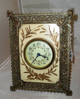 Lot 124 - A brass and pottery mantel clock