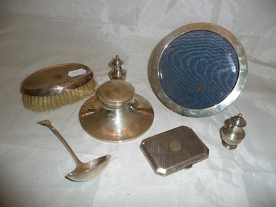 Lot 145 - A Georgian silver sauce ladle, a silver inkwell, silver photograph frame, etc