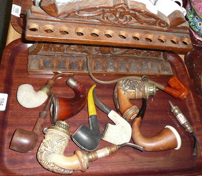 Lot 194 - Carved oak pipe rack and pipes together with a Hohner accordion