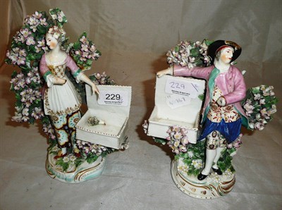 Lot 229 - A pair of Derby porcelain "Vendor" figures (damaged)