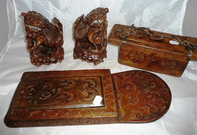 Lot 302 - A pair of Oriental carved hardwood Kylin's, an Eastern lidded box and a similar folding mirror