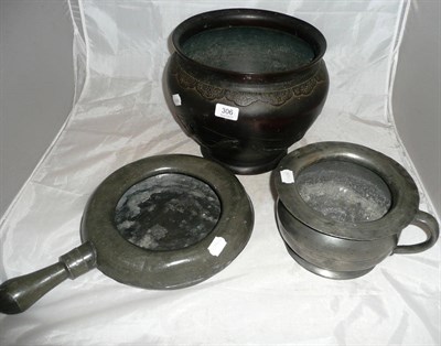 Lot 306 - A Japanese bronze jardiniere cast with fish, a pewter bed pan, and a pewter chamber pot