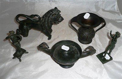 Lot 310 - A bronze figure of a rampant lion, two bronze classical figures, and two bronze vessels