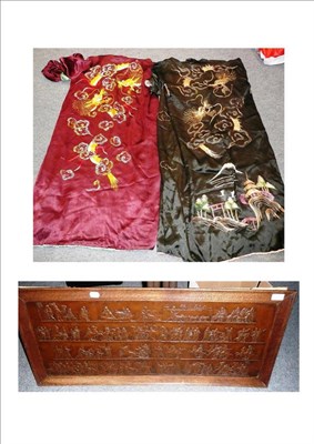 Lot 315 - Two Chinese embroidered satin robes and a oak framed bronzed metal plaque depicting classical...