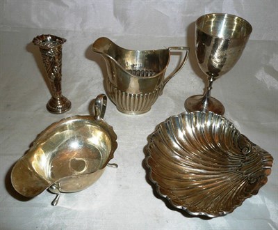 Lot 364 - A Victorian silver shell shaped dished, London 1897, a silver cream jug, another, a silver cup...