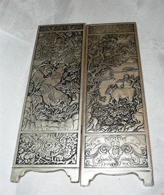 Lot 377 - A pair Oriental silver coloured metal plaques