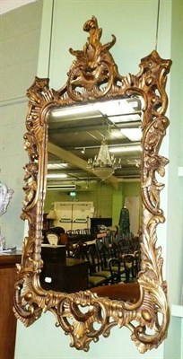 Lot 456 - An ornate gilt framed mirror