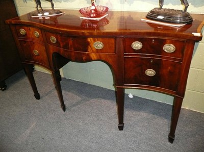 Lot 458 - A reproduction mahogany and satinwood banded serpentine sideboard, on square tapering legs