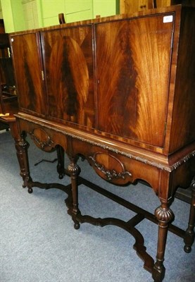 Lot 481 - A reproduction mahogany cabinet on carved supports