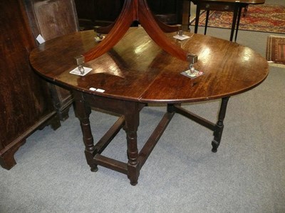 Lot 484 - Late 18th/early 19th century large oak gate leg dining table