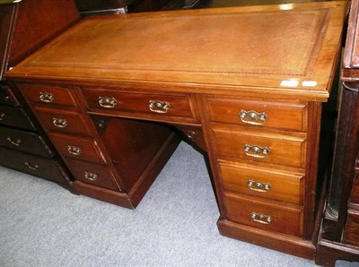 Lot 486 - Edwardian walnut kneehole desk