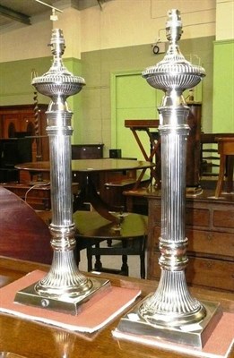 Lot 501 - A pair of 24 inch tall silver plated fluted column table lamps