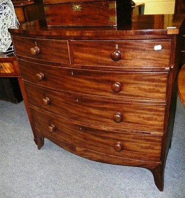 Lot 513 - Mahogany bow fronted chest of two small and three large drawers on splayed legs, circa 1810