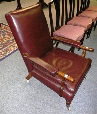 Lot 518 - Leather covered easy chair