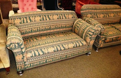 Lot 523 - Two drop end sofas with classical design upholstry