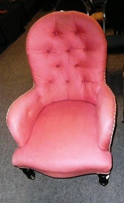 Lot 525 - A Victorian button back armchair in pink