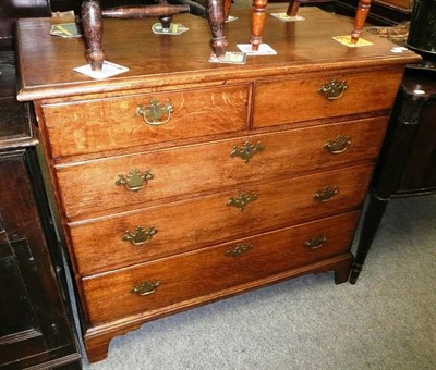 Lot 539 - An oak four height chest of drawers