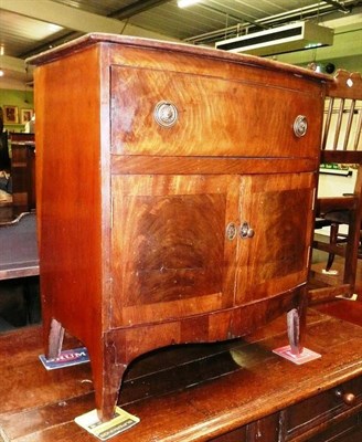 Lot 551 - Late Georgian bow front cabinet