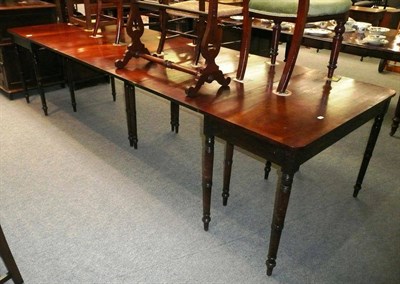 Lot 552 - Late George III mahogany dining table