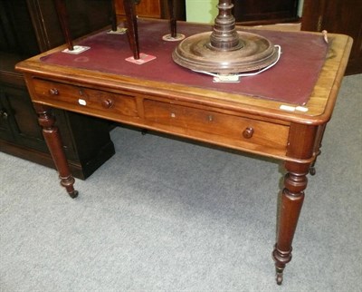 Lot 556 - A Victorian mahogany writing table, inset sciver and two drawers