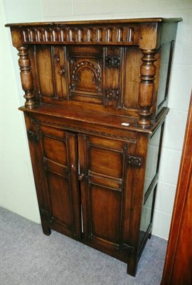 Lot 564 - A Titchmarsh & Goodwin style narrow oak court cupboard