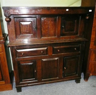 Lot 569 - Carved oak press cupboard