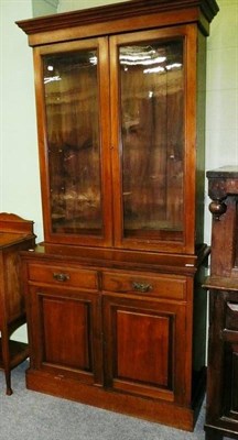 Lot 570 - An Edwardian walnut bookcase cabinet