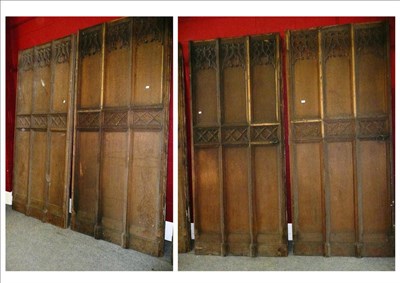 Lot 611 - A set of four carved oak Gothic doors, each approximately 250cm by 110cm