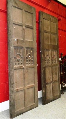 Lot 620 - A pair of panelled oak doors with glazed panels, each approximately 255cm by 82cm