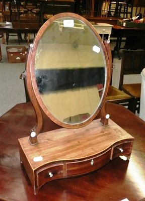 Lot 697 - Georgian mahogany serpentine front three drawer dressing table mirror