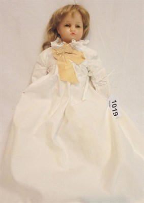 Lot 1019 - Late 19th Century Poured Wax Shoulder Doll, with fixed blue eyes, original wig, on a cloth body...