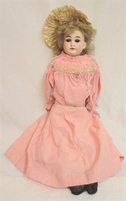 Lot 1020 - Bisque Shoulder Head Doll with brown fixed eyes, open mouth, original wig, on a kid leather...