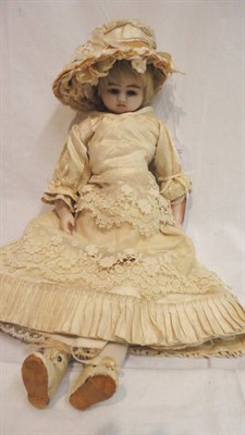 Lot 1026 - Late 19th Century Poured Wax Shoulder Head Doll with blue glass eyes, original blond wig, wax lower