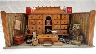 Lot 1044 - An Early 20th Century German Cherrywood Open Shop Display, comprising a run of grocers drawers...