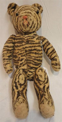 Lot 1046 - A Tiger Striped Jointed Soft Toy with boot button eyes, stitched nose, felt pads, 41 cm