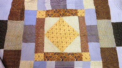 Lot 1056 - Late 19th Century Patchwork Quilt, 220 cm by 225 cm