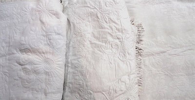 Lot 1058 - 19th Century White Quilt with floral motifs and tassle trim, 230 cm by 300 cm; Large Marcella...