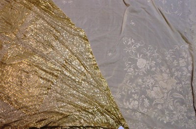 Lot 1067 - Cream and Gilt Metal Woven Assuit Shawl of geometric design, 130 cm by 270 cm; Cream Silk...