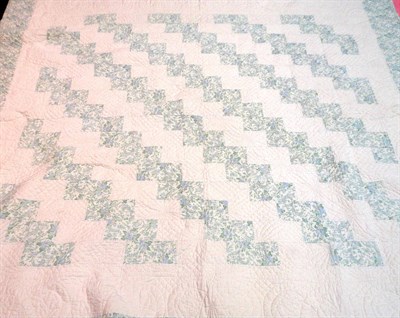 Lot 1070 - Faded Floral and Cream Quilt, 240 cm by 240 cm and a plain Pink Quilt, 250 cm by 200 cm (2)