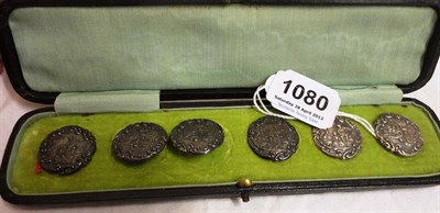 Lot 1080 - Six Silver Buttons in a Fitted Case by 'L&S' Birmingham 1900, embossed with scenes of a gent...