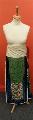 Lot 1111 - Chinese Green Figured Silk Panelled Skirt, embroidered with chrysanthemums and floral motifs,...