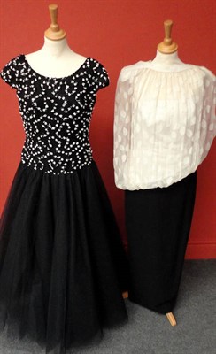 Lot 1146 - Three Circa 1980's Bruce Oldfield Custom Made Evening Gowns including a black net gown with...