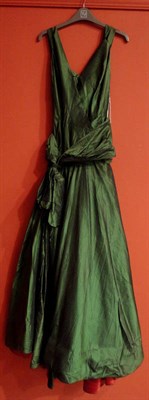 Lot 1147 - A Full Length Green Silk Evening Dress, with a cross over bodice, large bow detail to the front and