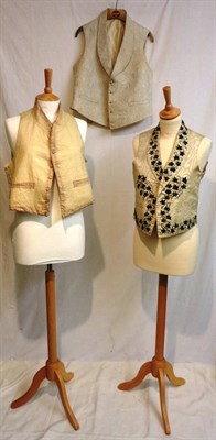 Lot 1176 - Early 19th Gents Silk Waistcoat embroidered with ivy leaves, with a white cotton back; Cream...