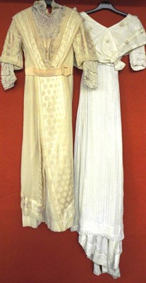 Lot 1181 - Four Edwardian Dresses including a cream silk and net mounted dress with short sleeves and...