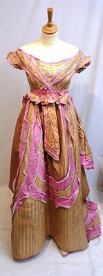 Lot 1191 - Circa 1870's Pink Striped Silk Evening Gown, worn off the shoulder with cap sleeves, lace and...